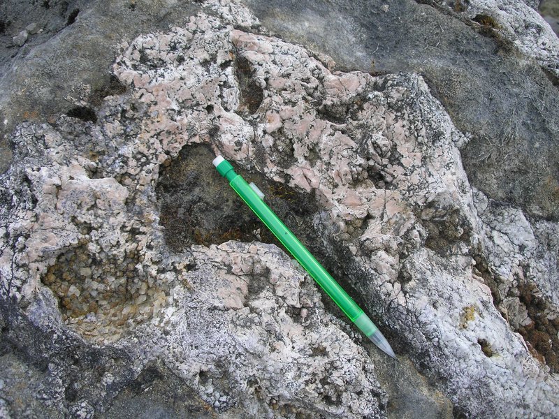 Barite, calcite and fluorite filling a large cavity within Carboniferous limestone